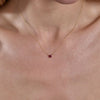 Gold ruby heart necklace on neck - elegant romantic layering jewelry