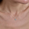 gold turquoise hamsa necklace on neck